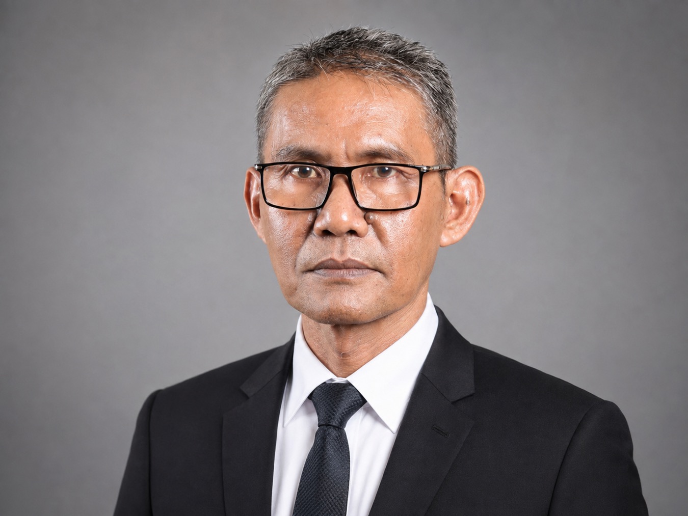 Dr. Faturrahman, M.M.